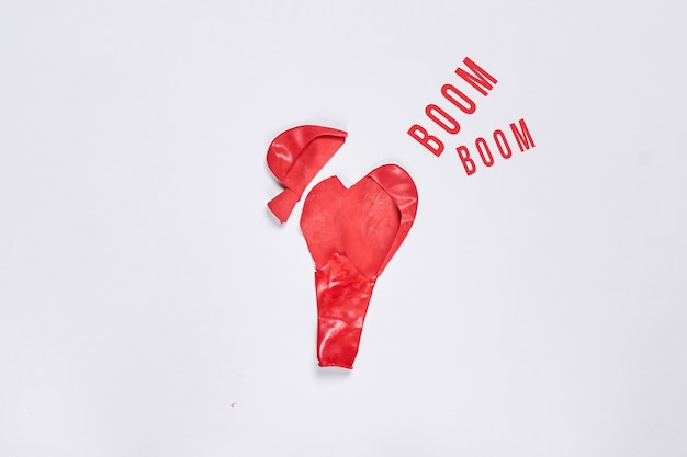 End of love love ended divorce concept torn red heart shape balloon on white background