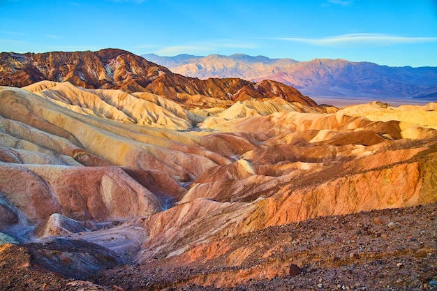 Endless layers of colors in sediment of Death Valley desert mountains