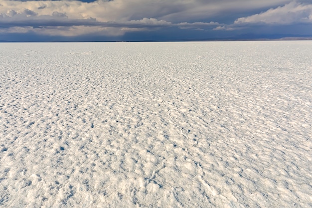 Endless road of salt lake of Salar de Uyuni in Altiplano, Bolivia