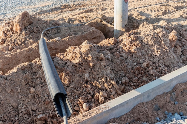 The ends of the electrical cable in the trench. Electrical cable installation. Cable ends.