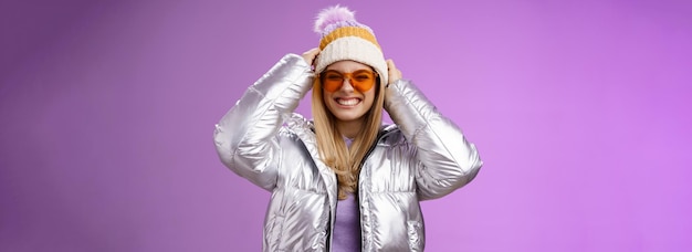 Energized daring sassy young attractive woman having fun friends winter trip learn snowboarding