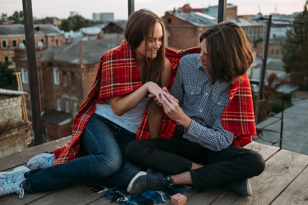 Engagement. Boyfriend puts a ring on his girlfriend finger. Love celebration family marriage relationship