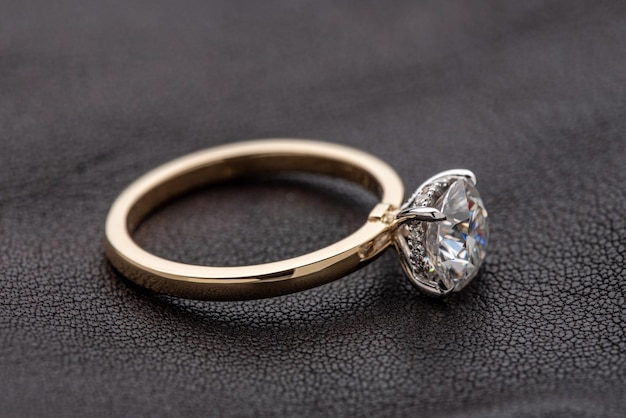 Engagement Diamond Ring on Leather Background