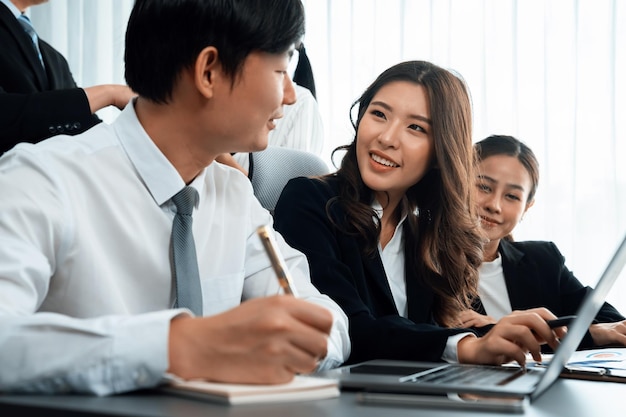 Engaging businesspeople working at desk together as concept of harmony in office