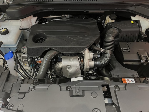 The engine compartment of the car, a view of the engine. Four-cylinder engine