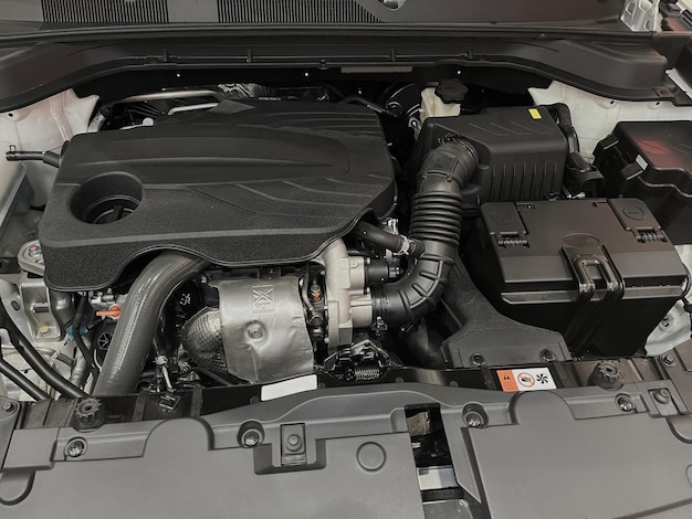 The engine compartment of the car, a view of the engine. Four-cylinder engine