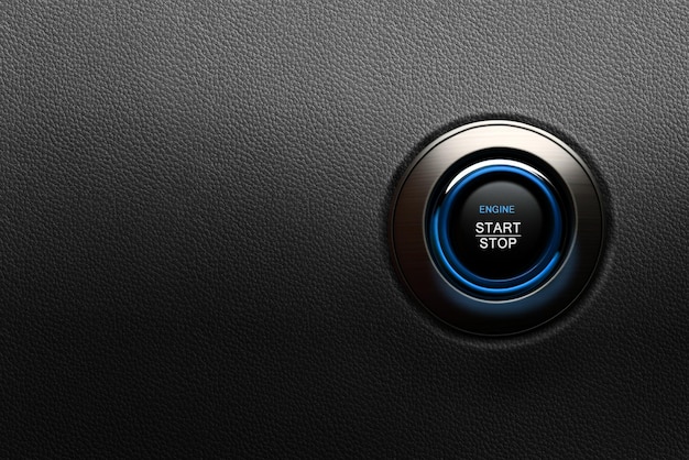 Engine start button with blue glowing ring on a modern car