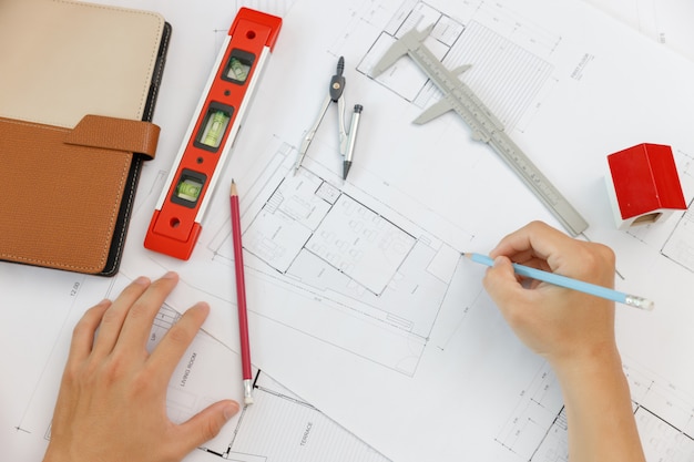 Engineer and Architect concept, Top view of Engineer Architects  and Interior designer office team working with blueprints