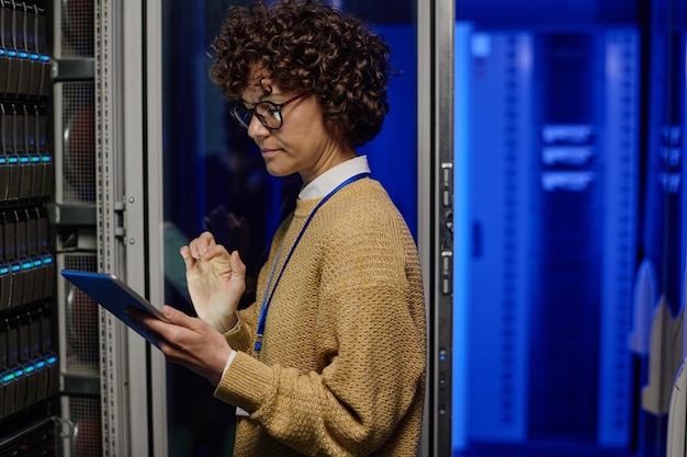 Engineer checking the work of computer network