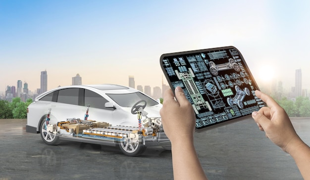 Engineer hold digital tablet with electric car user interface or digital graphic display