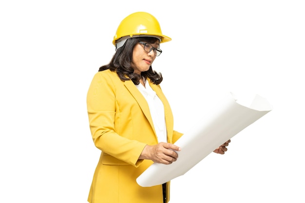 Engineer holding yellow helmet with blueprint isolated on white background with clipping path