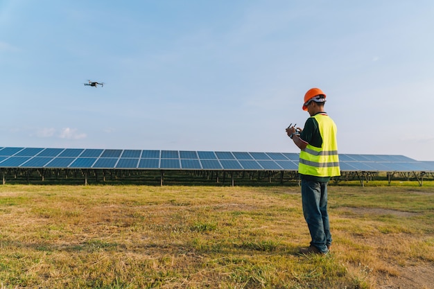  Engineer inspect and checking solar panel by Drone at solar power plant 