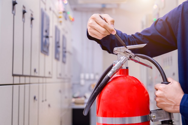 Engineer inspection Fire extinguisher in control room.