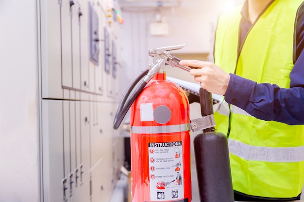 Engineer inspection Fire extinguisher in control room.