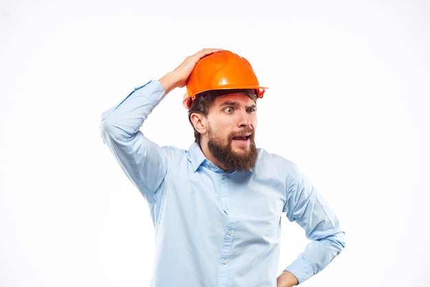 Engineer in orange safety helmet in construction emotions professional lifestyle