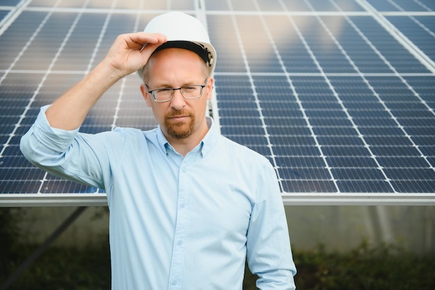 Engineer at solar power station with solar panel Practical lessons on renewable energy power plants