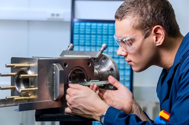 Engineer with a caliper measuring device in the modern laborator