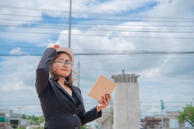 Engineer woman working at site of bridge under construction