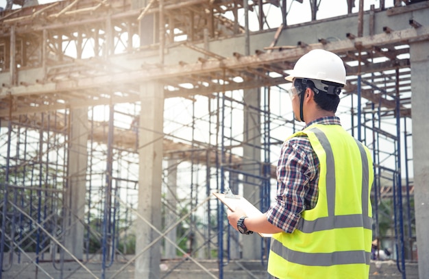 Engineer working on building site