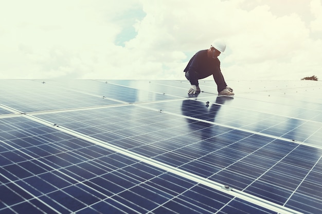 engineer working on replacement solar panel in solar 