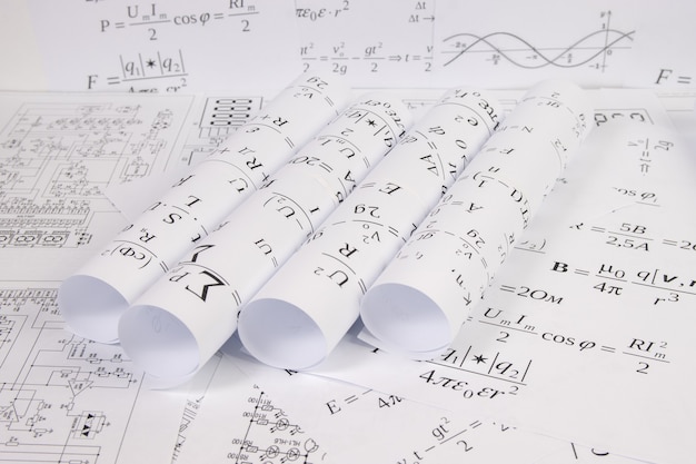 Engineering drawings with mathematical electrical formulas and graphs