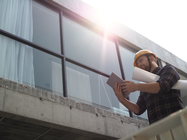 Engineering working at building site.