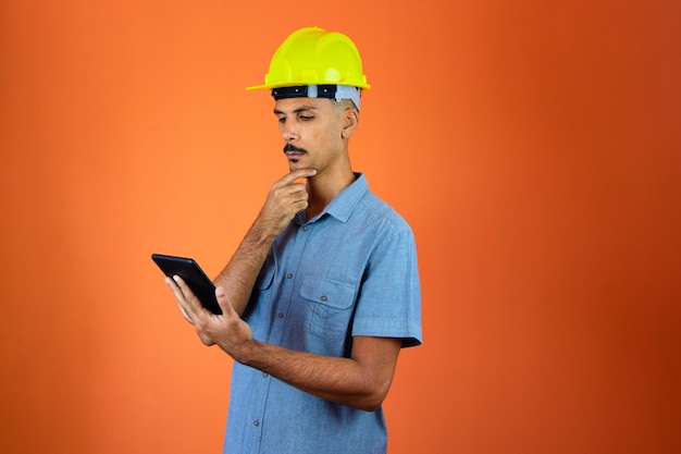 Engineers day Black Man in Safety Helmet and Blue Shirt isolated Engineer Holding Mobile