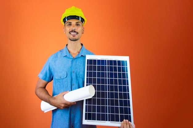 Engineers day Black Man in Safety Helmet and Blue Shirt isolated Engineer Holding Photovoltaic Solar Panel