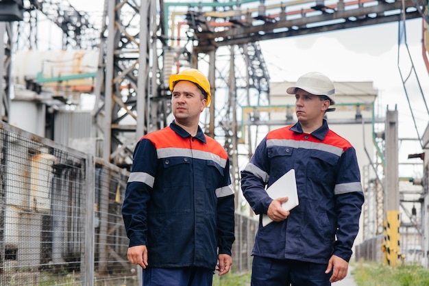 Engineers inspect the electrical substation