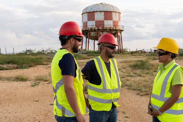 Engineers talk in an industrial park