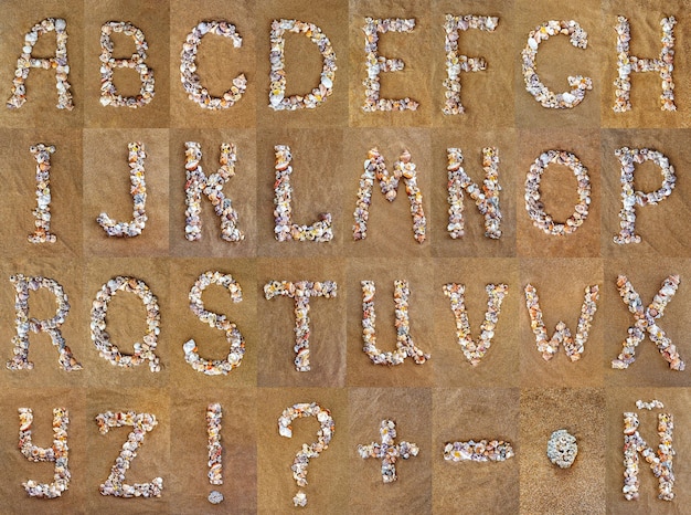 English alphabet a letter made of seashells on the sand