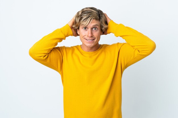 English man over isolated white wall doing nervous gesture