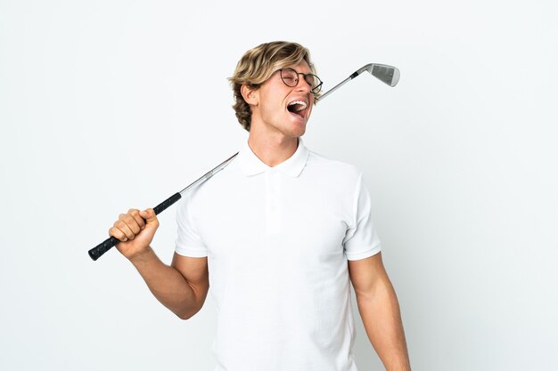 English man playing golf laughing