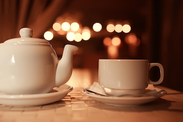 English tea in a cafe / cup and kettle with five o'clock tea