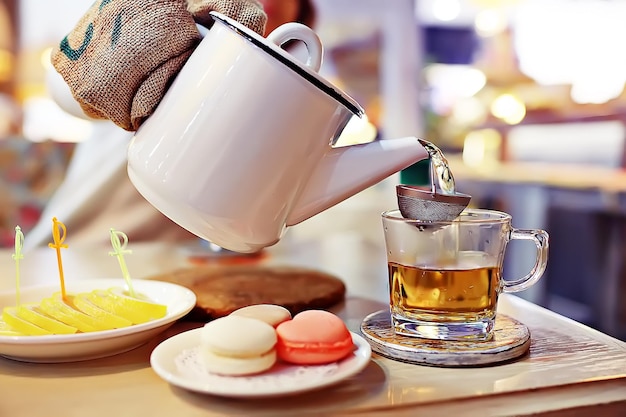 English tea in a cafe / cup and kettle with five o'clock tea