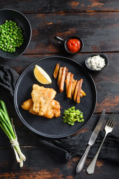 English Traditional Fish and chips with mashed minty peas and tartar sauce