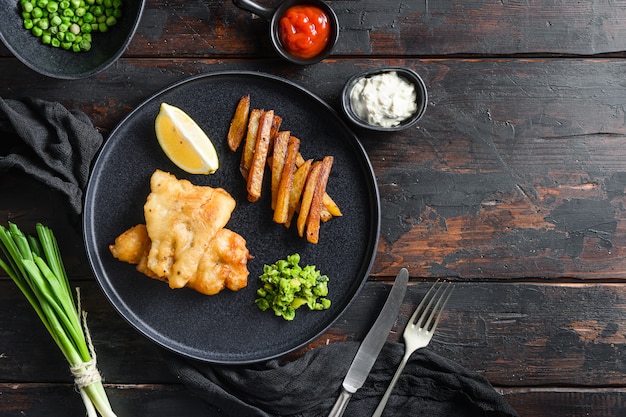 English Traditional Fish and chips with mashed minty peas and tartar sauce