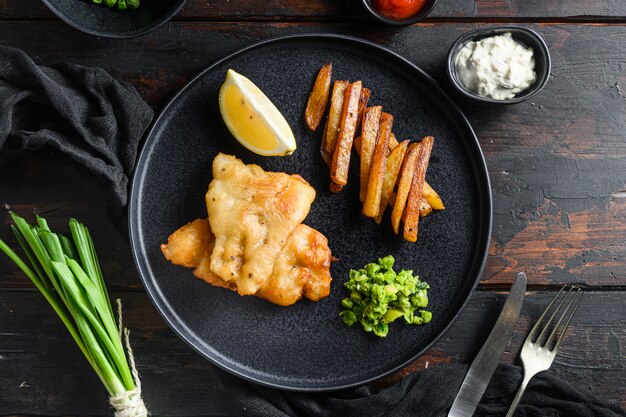 English Traditional Fish and chips with mashed minty peas and tartar sauce