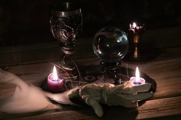 Photo enigmatic occult ritual with chalice and crystal ball