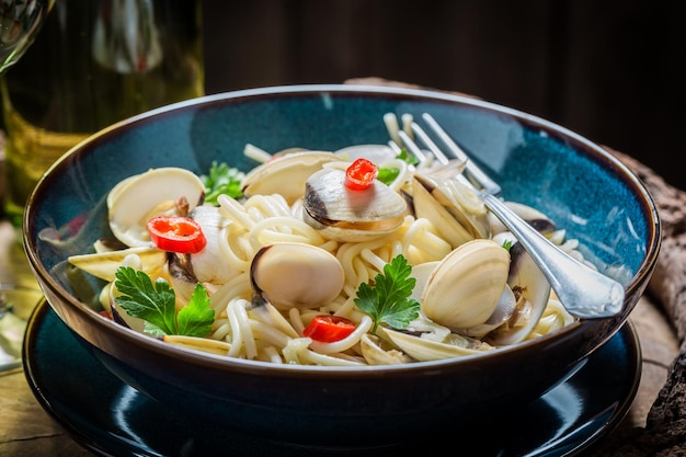 Enjoy your seafood pasta with clams parsley and peppers