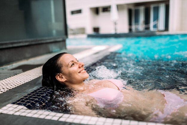 Enjoying in the swimming pool. Spa water treatments.