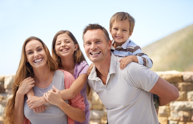 Enjoying their family holiday Portrait of a family looking happy while on holiday