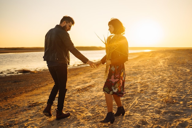 Enjoying time together Stylish and loving couple enjoying each other by the sea