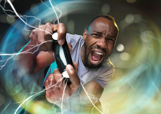 Enthusiastic gamer. Joyful young man holding a video game controller