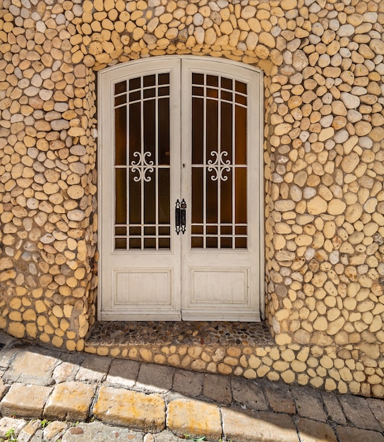 Entrance door decorated with pebbles