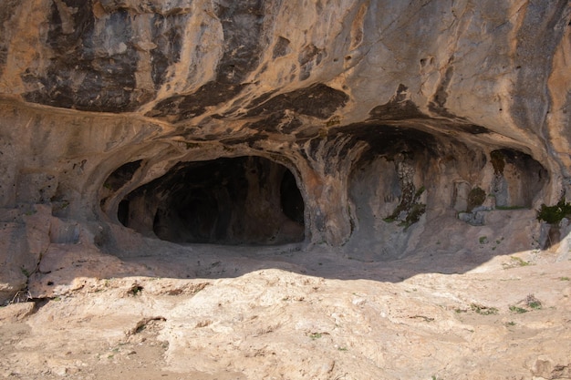 The entrance to the Karain cave in the rays of the sun