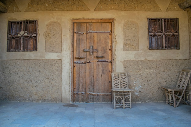 Entrance Wooden Door to a house Chair outside home