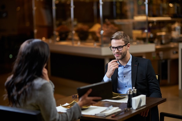 Entrepreneur is listening attentively to female speech