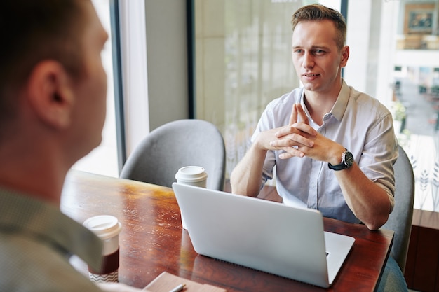 Entrepreneur listening to colleague