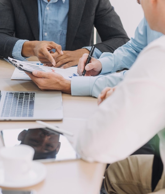 Entrepreneurs and business people conference in modern meeting room happy multiracial coworkers have fun cooperating working together at office meeting asian teamwork concept